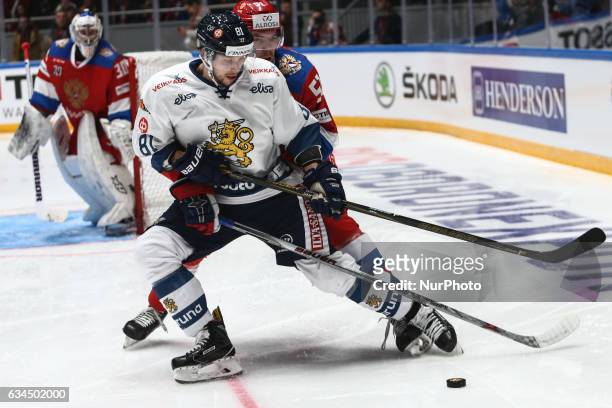 Team Finland's Jukka Peltola and Team Russias Alexei Berezgalov in action during the Euro Hockey Tour game between Russia and Finland at the...