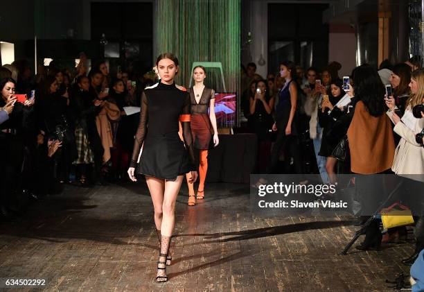 Models walk the runway at Katie Gallagher's fashion show during New York Fashion Week at Projective Space on February 9, 2017 in New York City.