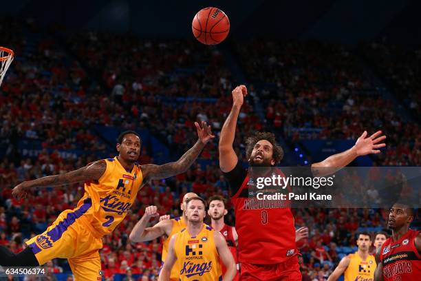 Greg Whittington of the Kings and Matt Knight of the Wildcats contest a rebound during the round 19 NBL match between the Perth Wildcats and the...