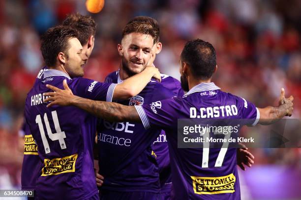 Adam Taggart of Perth Glory celebrates with teammates after he scored a goal during the round 19 A-League match between Adelaide United and Perth...