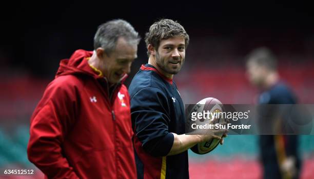 Wales player Leigh Halfpenny shares a joke with Head coach Robert Howley during Wales captain's run ahead of their RBS Six Nations match against...