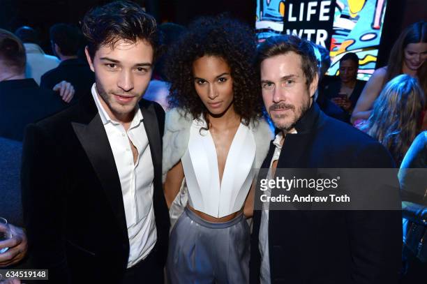 Francisco Lachowski, Cindy Bruna and Mark Tevis attend The Daily Front Row x LIFEWTR New York Fashion Week opening night at Kola House on February 9,...