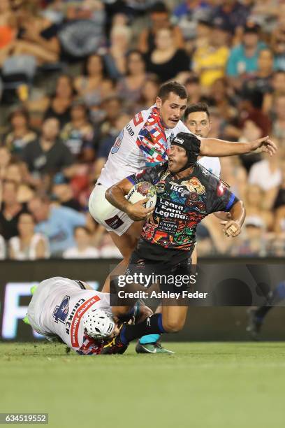 Johnathan Thurston of Indigenous All Stars is tackled by the World All Stars defence during the NRL All Stars match between the 2017 Harvey Norman...