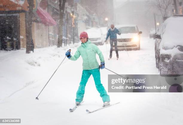 Frances Buerkens, front, and Michelle Devoe, both of Portland ski down Exchange Street on Thursday, Feb. 9 as heavy snow falls across the region.