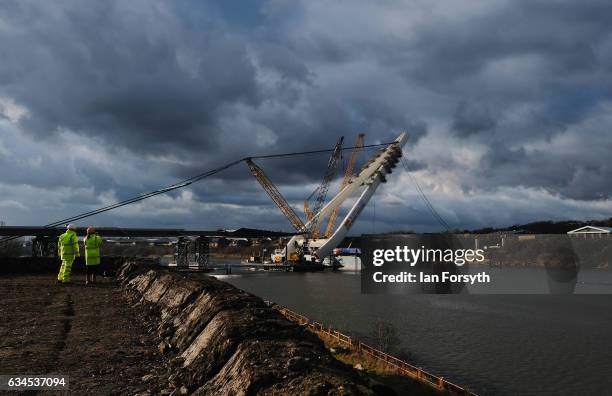 Late afternoon sunlight reflects off the final 100 metre centrepiece of Sunderland's new River Wear crossing as it is lifted into place on February...