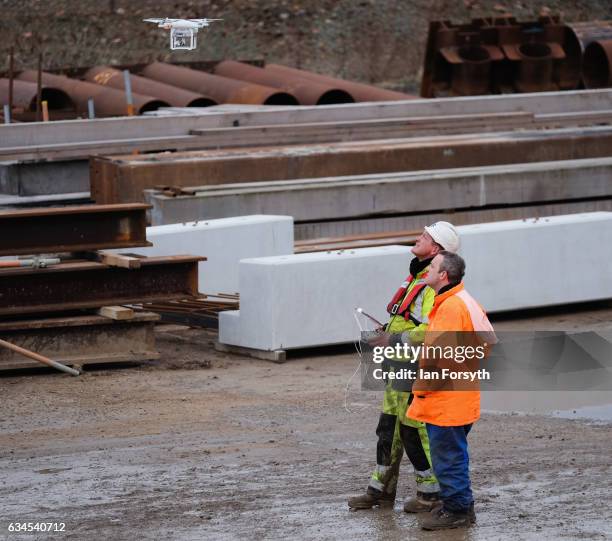 Drone operator prepares to fly as the final 100 metre centrepiece of Sunderland's new River Wear crossing is lifted into place on February 10, 2017...