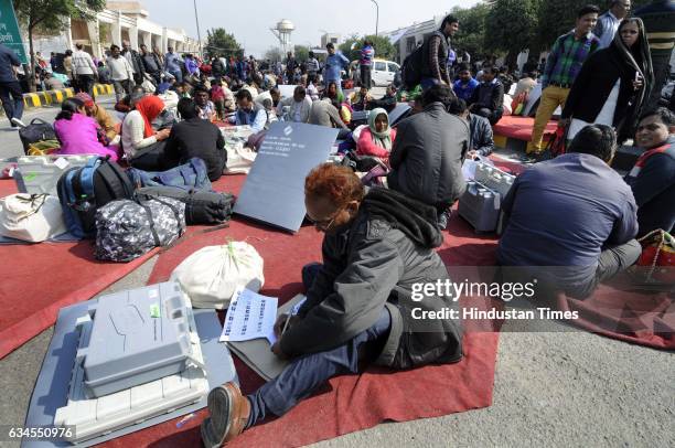 Day ahead of elections in Gautam Budh Nagar, Block Level Officers carrying EVMs to their respective booths, on February 10, 2017 in Noida, India. The...