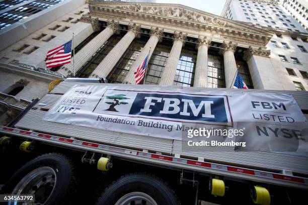 Foundation Building Materials LLC signage is displayed on a truck in front of the New York Stock Exchange during the company's initial public...