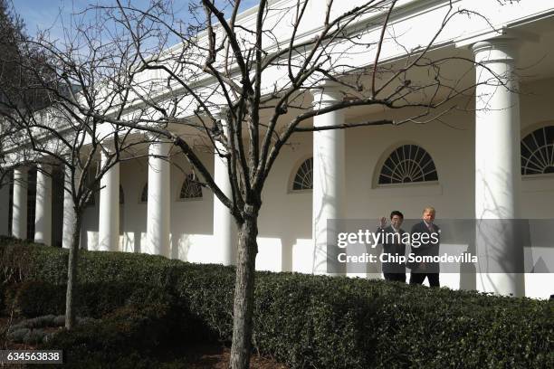 President Donald Trump and Japan Prime Minister Shinzo Abe walk together to their joint press conference in the East Room at the White House on...