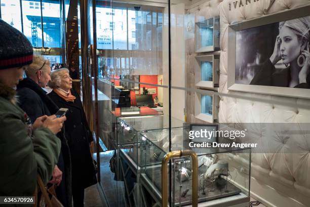 Women browse jewelry for sale at the 'Ivanka Trump Collection' shop in the lobby at Trump Tower, February 10, 2017 in New York City. According to a...