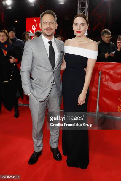 Actors Moritz Bleibtreu and Antje Traue attend the 'Bye Bye Germany' premiere during the 67th Berlinale International Film Festival Berlin at...