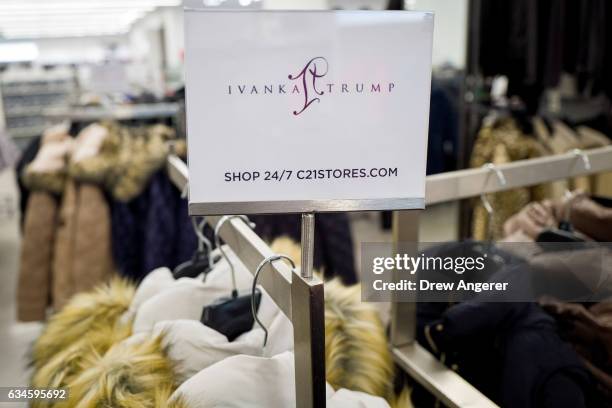 Sign for Ivanka Trump brand is displayed atop a rack of Ivanka Trump brand coats for sale at the Century 21 department store February 10, 2017 in New...