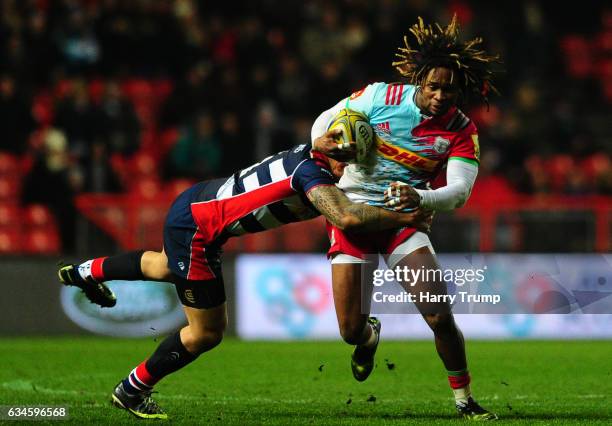 Marland Yarde of Harlequins is tackled by Billy Searle of Bristol Rugby during the Aviva Premiership match between Bristol Rugby and Harlequins at...