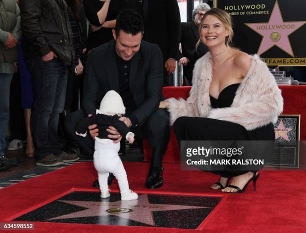 Recording artist Adam Levine with wife model Behati Prinsloo and daughter Dusty Rose pose after he was honored with a Star on the Hollywood Walk of...