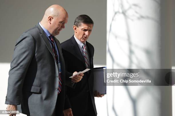 White House National Security Advisor Michael Flynn walks down the West Wing Colonnade following a bilateral meeting between U.S. President Donald...