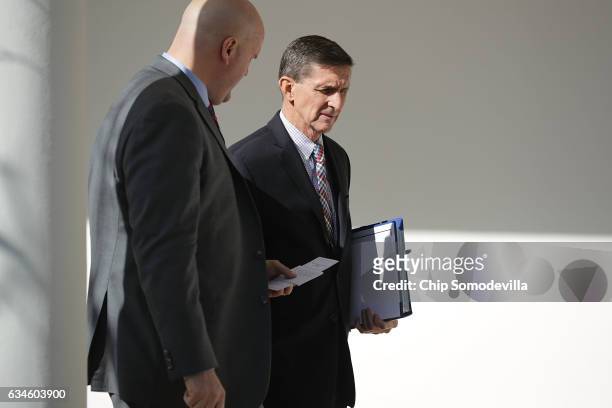 White House National Security Advisor Michael Flynn walks down the West Wing Colonnade following a bilateral meeting between U.S. President Donald...