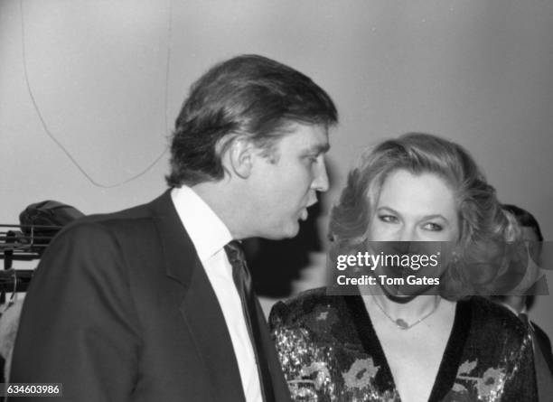 Businessman Donald Trump chats with actress Kathleen Turner at the D.W. Girffith Awards At Lincoln Center Library in February 1988 in New York, New...