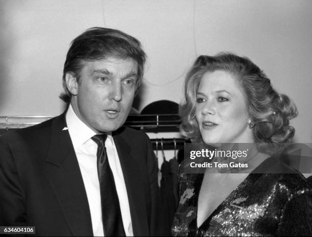 Businessman Donald Trump chats with actress Kathleen Turner at the D.W. Girffith Awards At Lincoln Center Library in February 1988 in New York, New...