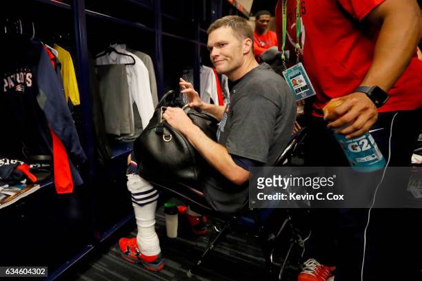 Tom Brady of the New England Patriots looks for his missing jersey in the locker room after defeating the Atlanta Falcons during Super Bowl 51 at NRG...