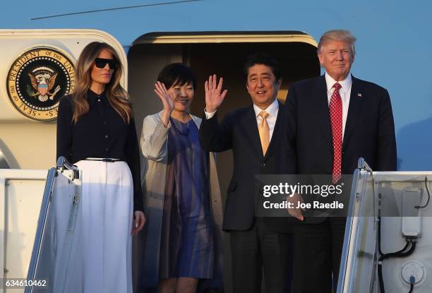 President Donald Trump and his wife Melania Trump arrive with Japanese Prime Minister Shinzo Abe and his wife Akie Abe on Air Force One at the Palm...