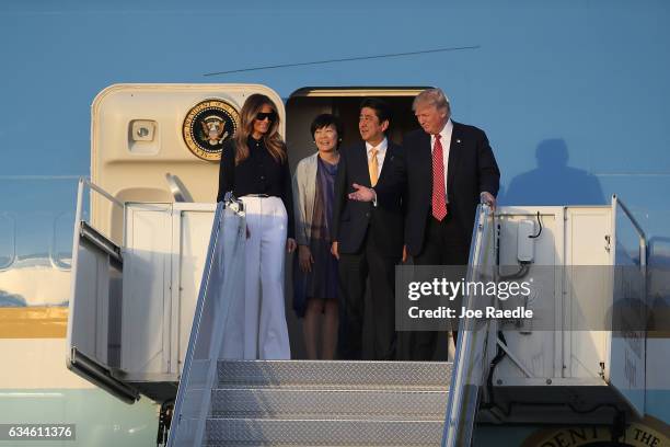 President Donald Trump and his wife Melania Trump arrive with Japanese Prime Minister Shinzo Abe and his wife Akie Abe on Air Force One at the Palm...