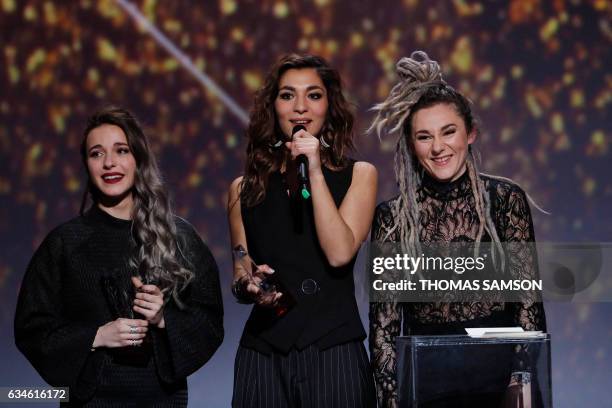 French band L.E.J's members singer Elisa Paris, French singer Lucie Lebrun and violoncellist Juliette Saumagne react after receive after receiving...