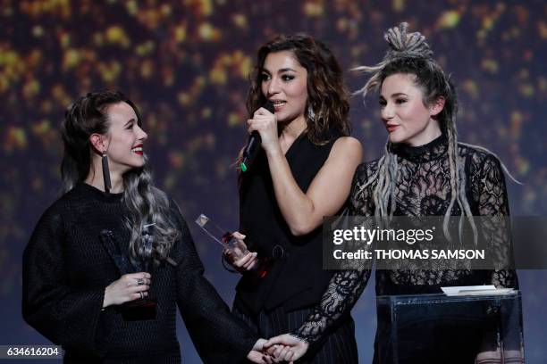 French band L.E.J's members singer Elisa Paris, French singer Lucie Lebrun and violoncellist Juliette Saumagne react after receive after receiving...