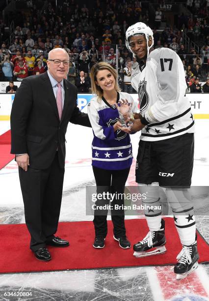 Deputy NHL Commissioner Bill Daly and anthem singer Courtney Daniels present Wayne Simmonds of the Philadelphia Flyers with the 2017 Honda NHL...