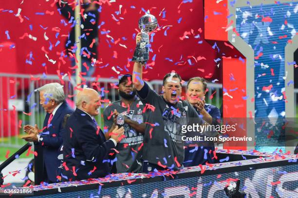 New England Patriots quarterback Tom Brady holds uo the Vince Lombardi Trophy after winning Super Bowl LI on February 5 at NRG Stadium in Houston, TX.