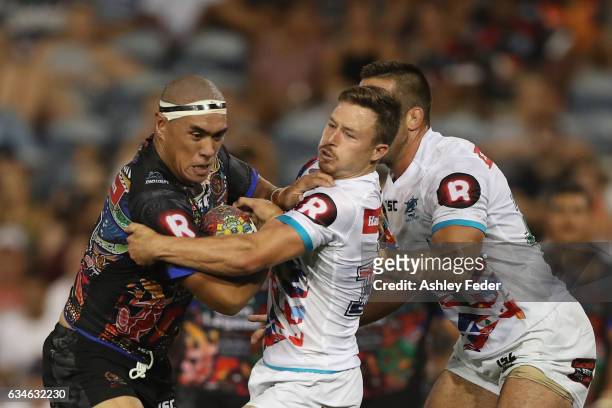 Leilani Latu of Indigenous All Stars is tackled by Gavin Cooper of the World All Stars during the NRL All Stars match between the 2017 Harvey Norman...