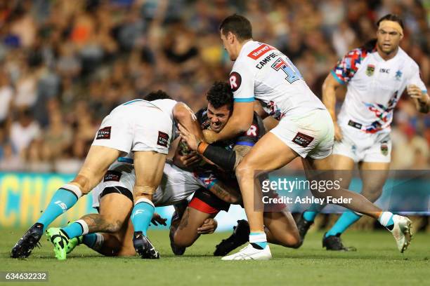 Andrew Fifita of Indigenous All Stars is tackled by the World All Stars defence during the NRL All Stars match between the 2017 Harvey Norman All...