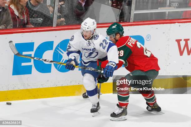 Jason Pominville of the Minnesota Wild defends Erik Condra of the Tampa Bay Lightning during the game on February 10, 2017 at the Xcel Energy Center...