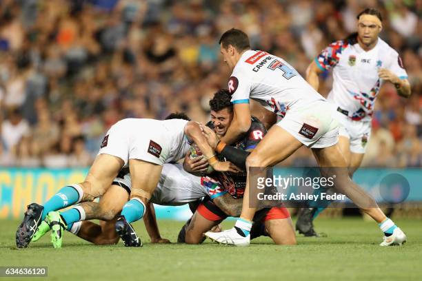 Andrew Fifita of Indigenous All Stars is tackled by the World All Star defence during the NRL All Stars match between the 2017 Harvey Norman All...