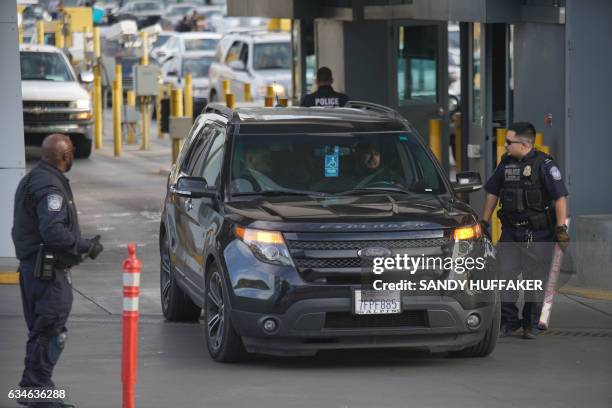 Customs and Border Protection agents check vehicles entering the United States at the San Ysidro Port of Entry in San Ysidro, California on Friday,...