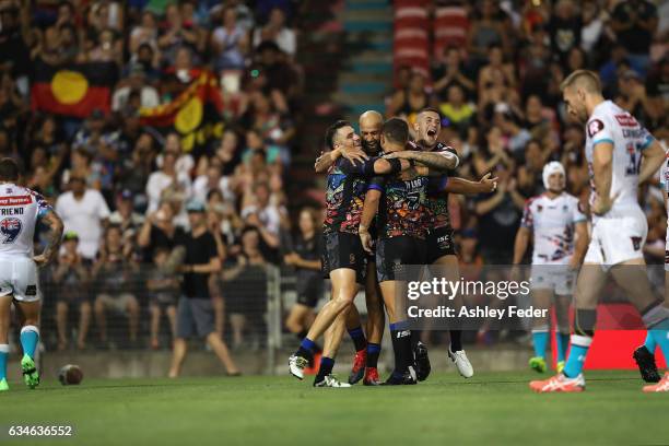 Blake Ferguson and Joel Thompson of the Indigenous All Stars celebrate a try from Ashley Taylor during the NRL All Stars match between the 2017...