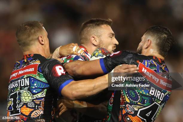 Bryce Cartwright of the World All Stars is tackled by the Indigenous All Stars defence during the NRL All Stars match between the 2017 Harvey Norman...