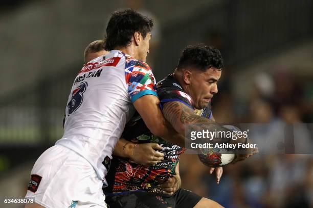 Andrew Fitita of Indigenous All Stars is tackled by World All Stars defence during the NRL All Stars match between the 2017 Harvey Norman All Stars...