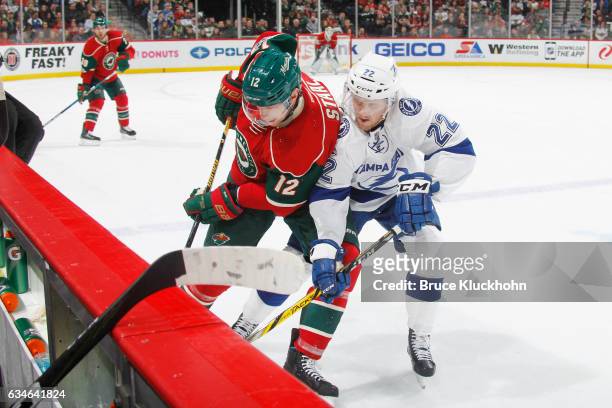 Eric Staal of the Minnesota Wild and Erik Condra of the Tampa Bay Lightning battle for the puck along the boards during the game on February 10, 2017...