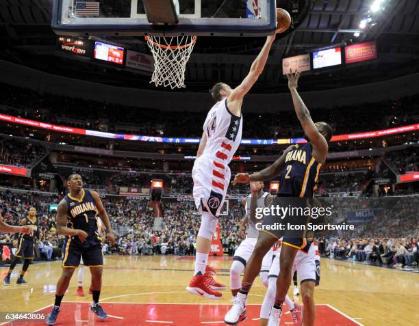 Washington Wizards forward Jason Smith blocks the shot of Indiana Pacers guard Rodney Stuckey on February 10 at the Verizon Center in Washington,...