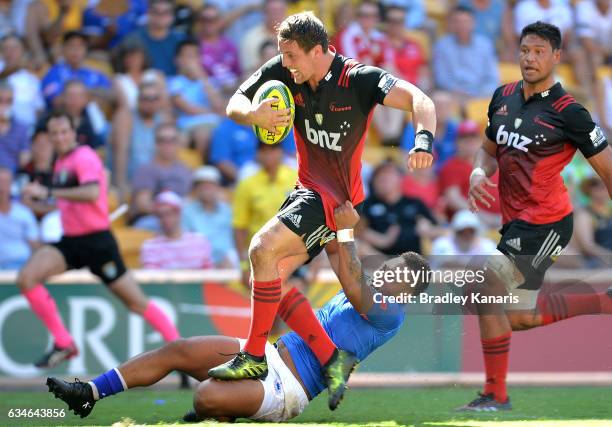Jed Brown of the Crusaders breaks through the defence during the Rugby Global Tens match between the Crusaders and Somoa at Suncorp Stadium on...