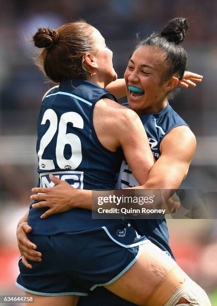 Darcy Vescio of the Blues is congratulated by Shae Audley of the Blues after kicking a goal during the round two AFL Women's match between the...