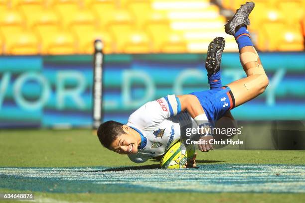 Yoshikazu Fujita of the Panasonic Wild Knights scores a try during the Rugby Global Tens match between Wild Knights and Rebels at Suncorp Stadium on...