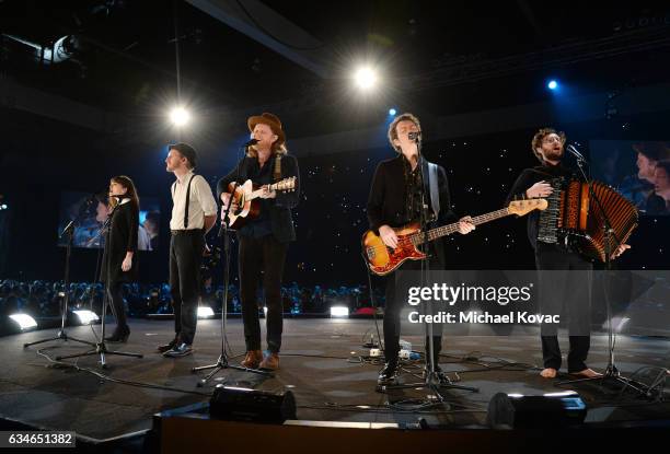 Musicians Neyla Pekarek, Jeremiah Caleb Fraites, Wesley Schultz, Byron Isaacs, and Stelth Ulvang of The Lumineers perform onstage during MusiCares...