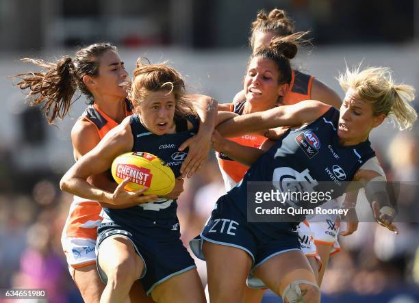 Nat Exon of the Blues is tackled during the round two AFL Women's match between the Carlton Blues and the Greater Western Sydney Giants at Ikon Park...