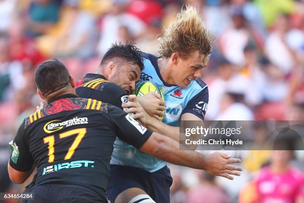 Ned Hanigan of the Waratahs is tackled during the Rugby Global Tens match between Waritahs and Chiefs at Suncorp Stadium on February 11, 2017 in...