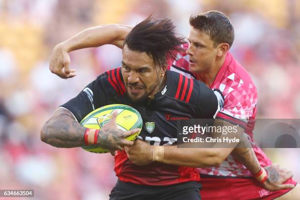 Digby Ioane of the Crusaders makes a break to score a try during the Rugby Global Tens match between Crusaders and Reds at Suncorp Stadium on...