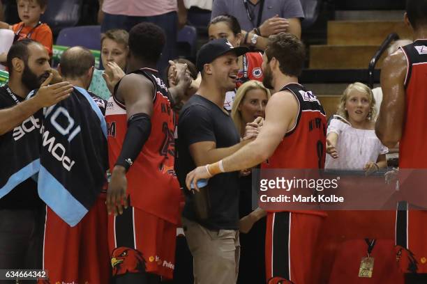 Former NRL palyer and televison personality Beau Ryan shakes hands Mitchell Norton of the Hawks after the match during the round 19 NBL match between...