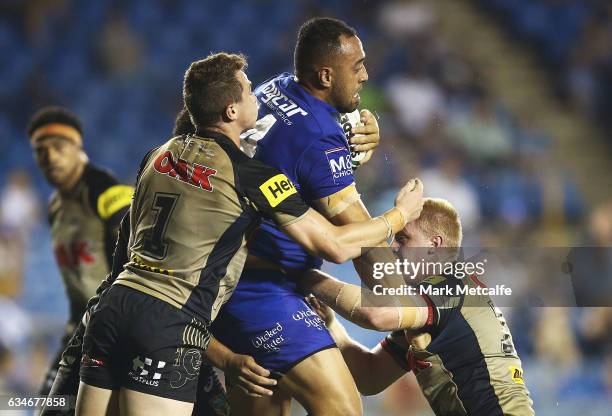 Sam Kasiano of the Bulldogs is tackled during the NRL Trial match between the Canterbury Bulldogs and the Penrith Panthers at Belmore Sports Ground...