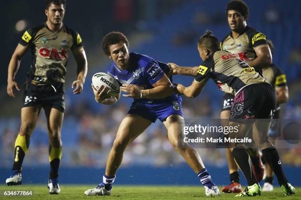 Raymond Faitala-Mariner of the Bulldogs is tackled during the NRL Trial match between the Canterbury Bulldogs and the Penrith Panthers at Belmore...