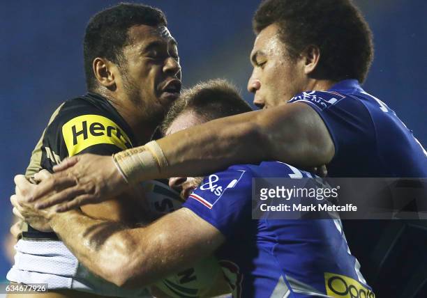 Waqa Blake of the Panthers is tackled during the NRL Trial match between the Canterbury Bulldogs and the Penrith Panthers at Belmore Sports Ground on...